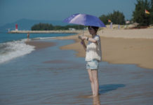 China’s Hainan Quickly Backtracks on Plan to Offer Censorship-Free Internet for Foreign Tourists In this picture taken on October 12, 2016, a tourist enjoys the beach at the Club Med resort in Sanya, Hainan Province in China. (Nicolas Asfouri/AFP/Getty Images)