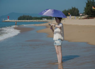 China’s Hainan Quickly Backtracks on Plan to Offer Censorship-Free Internet for Foreign Tourists In this picture taken on October 12, 2016, a tourist enjoys the beach at the Club Med resort in Sanya, Hainan Province in China. (Nicolas Asfouri/AFP/Getty Images)