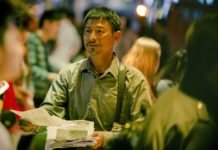 Missing children in China: The search goes on Lei handing out flyers and photographs of his missing son in the film Lost and Love. (Source: China Lion film distribution)